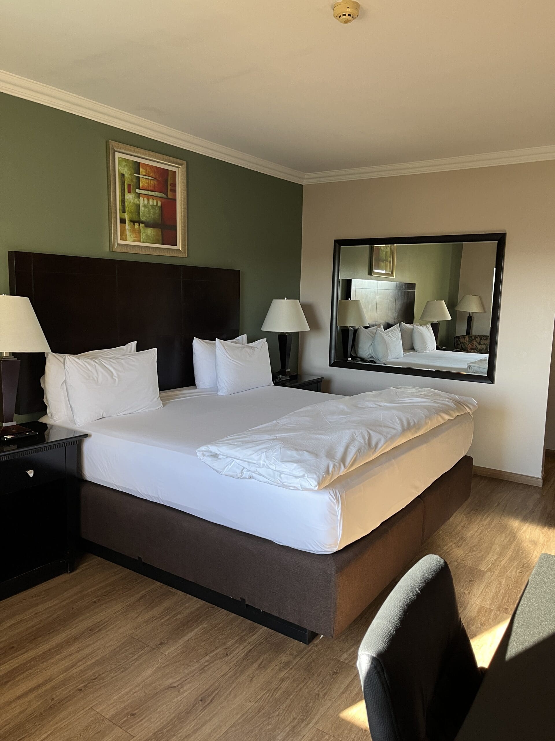 Hampshire king bed with white linen sheets and cover